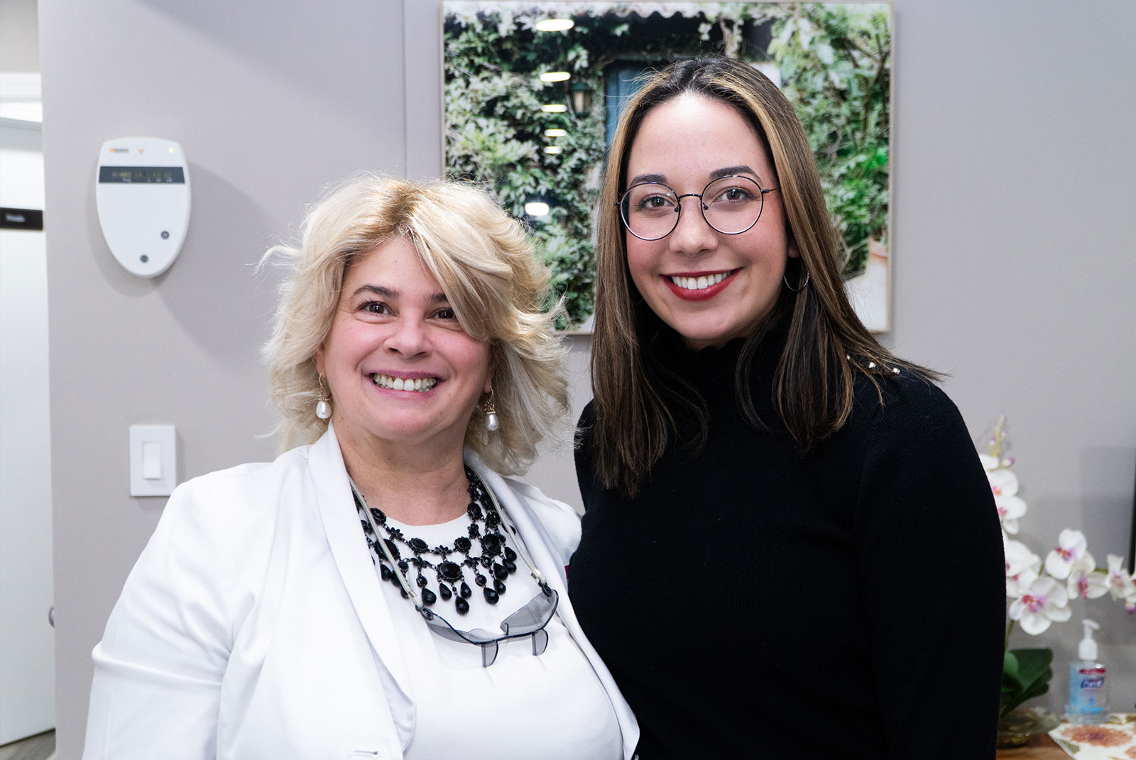patient and doctor smiling together after patients dental procedure