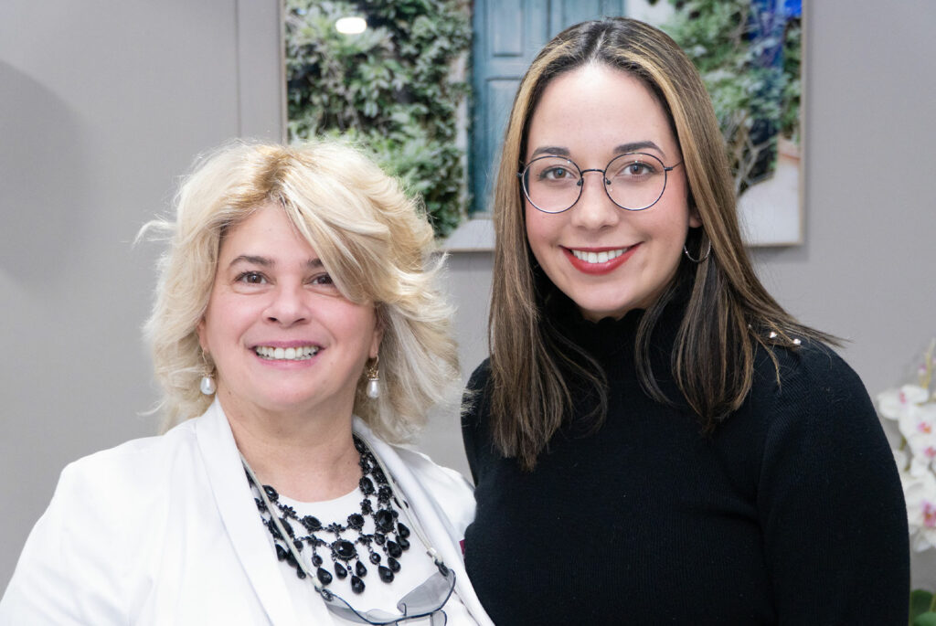 patient and doctor smiling brightly after patient's dental procedure